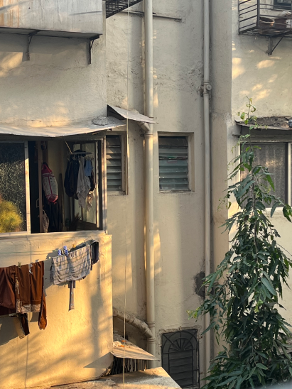 A balcony with clothes drying